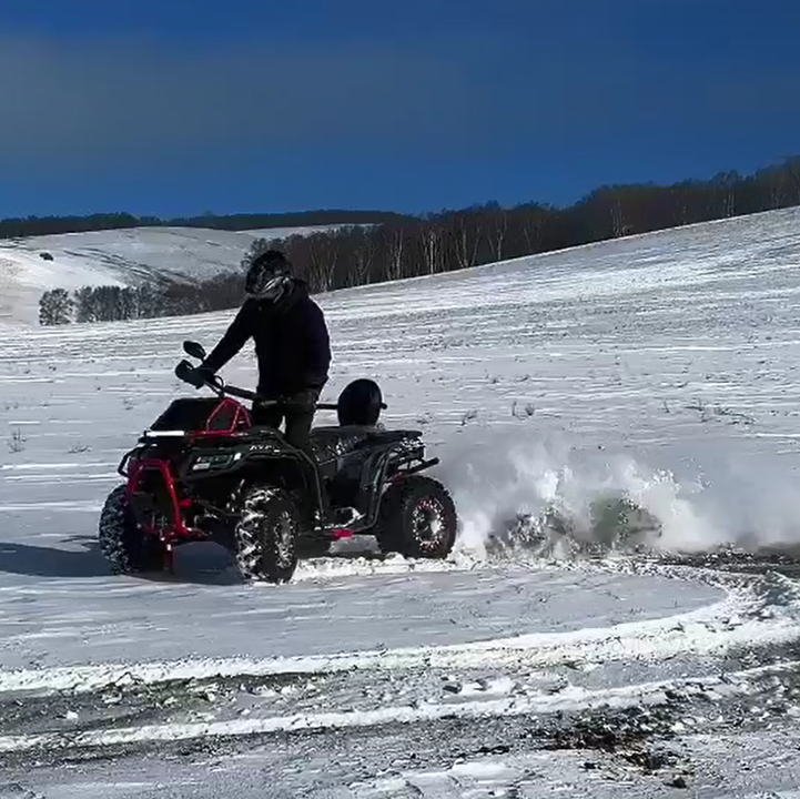 ATV-400 400cc all-terrain vehicle with rugged tires, front bumper guard, and passenger seat for snow and mountain riding